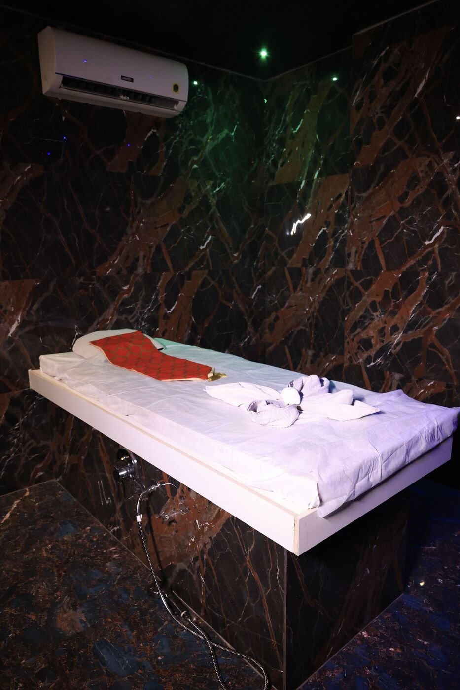Massage table in a marble treatment cabin at our Dombivli spa
